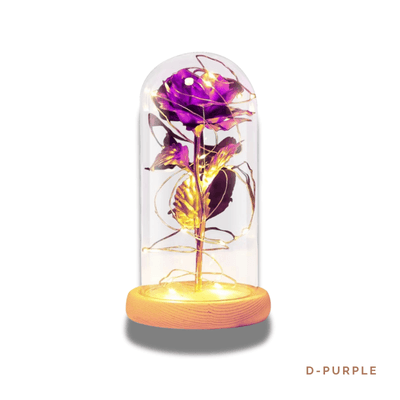 D-PURPLE: Elegant glass dome featuring a preserved violet rose with golden accents and soft LED lights, symbolizing enchantment, admiration, and eternal love.