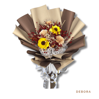 Debora arrangement on a plain background: Rustic bouquet of bright yellow wood sunflowers with dried red and beige accents, wrapped in rich brown and cream tones.