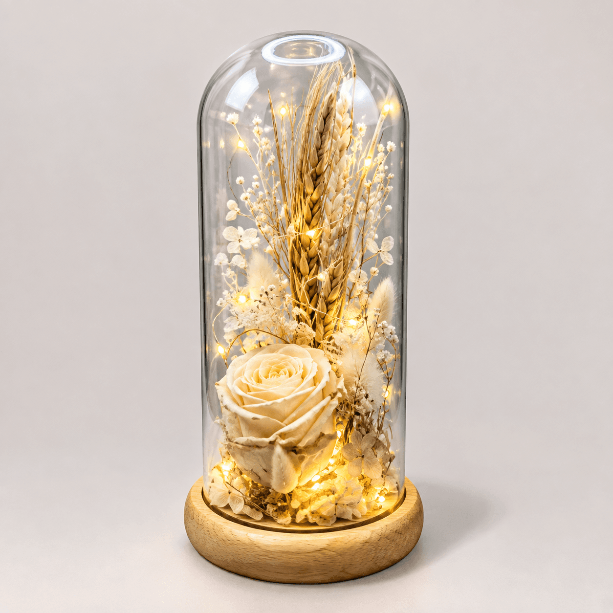 Fern: Elegant preserved flowers in a glass dome, symbolizing timeless beauty, lasting affection, and graceful simplicity.