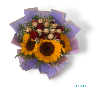 Flora arrangement on a plain background: Charming mix of Ferrero Rocher chocolates, red roses, and vibrant sunflowers—perfect for a sweet and thoughtful surprise.