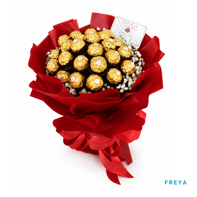 Freya arrangement on a plain background: Luxurious bouquet of 24 Ferrero Rocher chocolates, beautifully arranged for a sweet and indulgent gift.