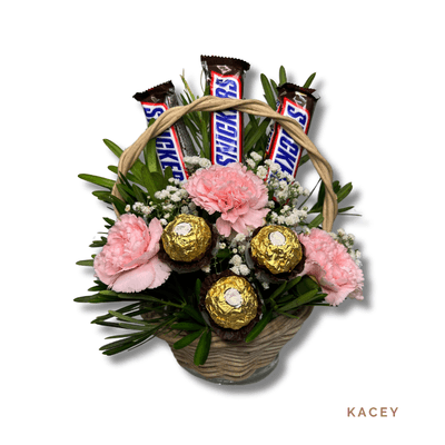 Kacey: Charming basket of 3 carnations, 3 Snickers bars, and 3 Ferrero Rocher chocolates—a sweet blend of flowers and treats.