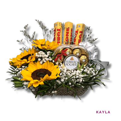 Kayla: Charming basket of 3 sunflowers and 6 Dairy Milk bars, blending bright blooms with sweet treats.