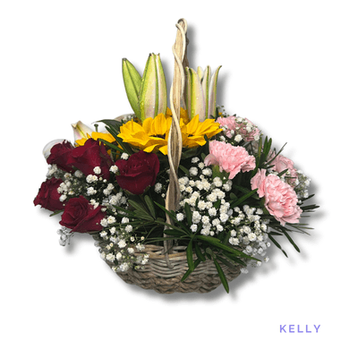 Kelly: Six red roses, six pink carnations, fragrant lilies, and three sunflowers create a radiant, heartfelt basket arrangement.
