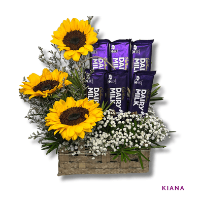 Kiana: Cheerful basket of 3 sunflowers, Toblerone bars, and Ferrero Rocher chocolates, perfect for brightening someone’s day.