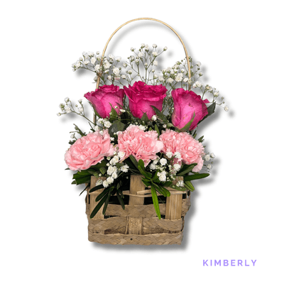 Kimberly: Three pink carnations paired with three fuchsia roses, beautifully arranged with greenery to express love, admiration, and gratitude.