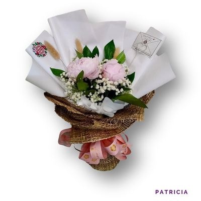 Patricia: Two premium peonies with delicate fillers, beautifully wrapped to brighten days and celebrate intimate, heartfelt moments.