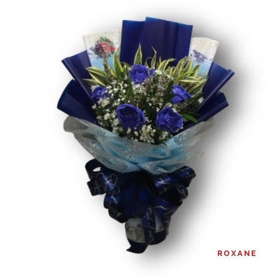 Roxane: Lovely half-dozen spray roses with a vibrant color finish, perfect for romantic gestures and special occasions.