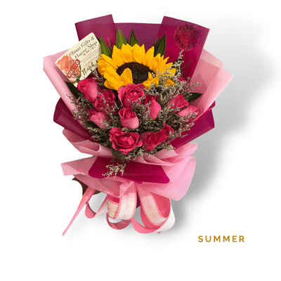 Summer arrangement on a plain background: A radiant sunflower paired with twelve pink roses, symbolizing warmth, admiration, sweetness, and vibrant love.
