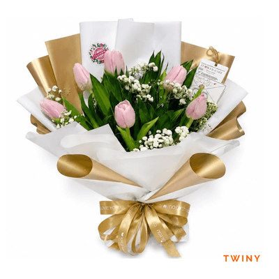 Twiny arrangement on a plain background: Six soft pink tulips symbolizing grace and affection, perfect for expressing admiration and celebrating beautiful, heartfelt moments.